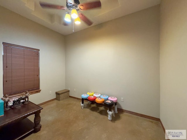 playroom with ceiling fan and carpet floors