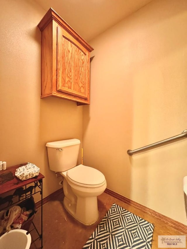 bathroom featuring toilet