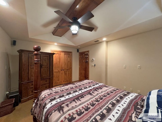 bedroom with ceiling fan, lofted ceiling, and light carpet