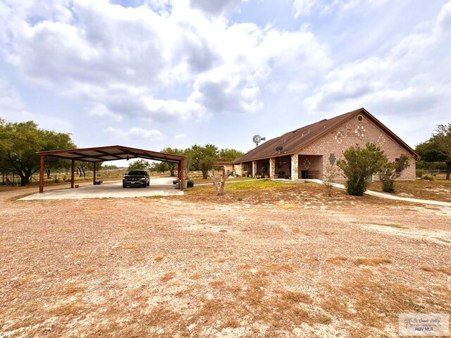 exterior space with a carport