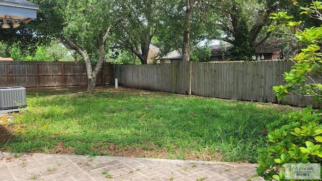 view of yard with central AC unit