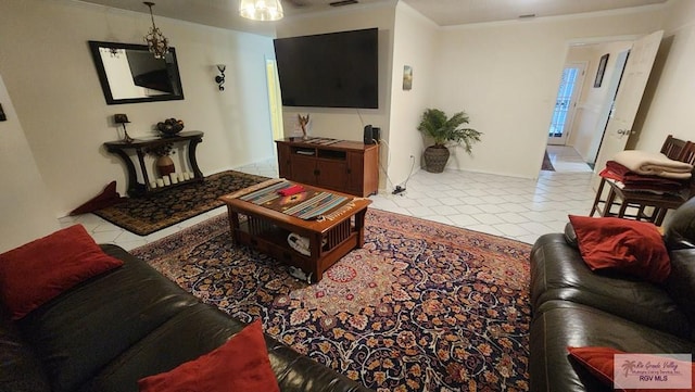 living room featuring crown molding and light tile patterned flooring