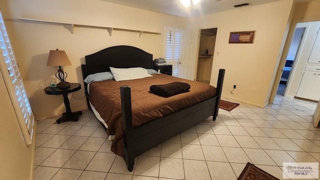 bedroom featuring light tile patterned floors