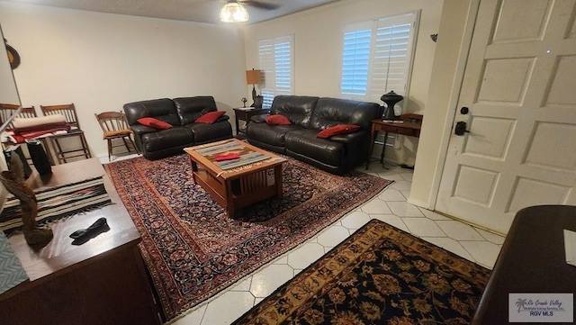 tiled living room with ceiling fan