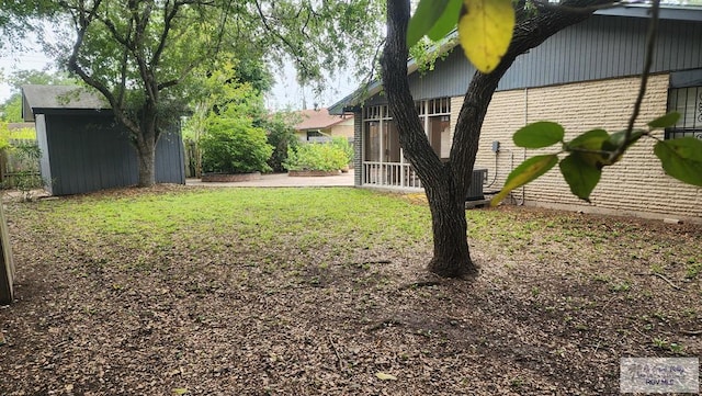 view of yard featuring a sunroom