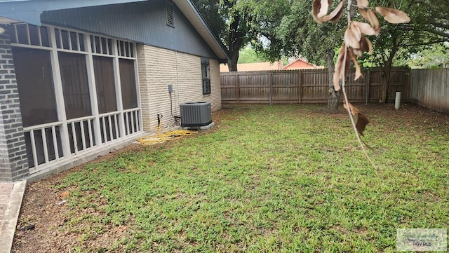 view of yard with central air condition unit