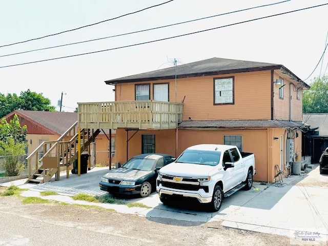 view of property with a balcony