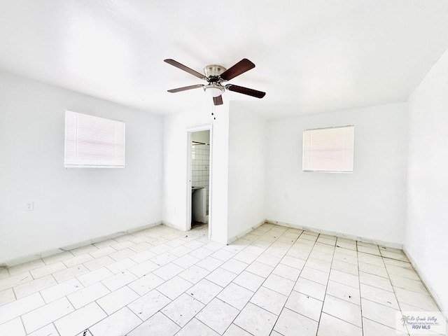 unfurnished room with light tile patterned floors and ceiling fan