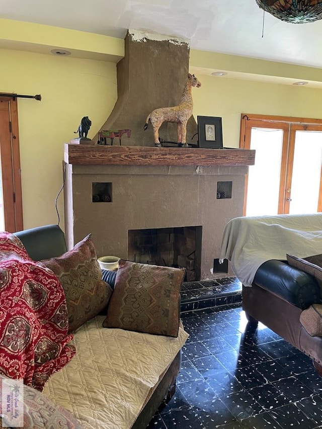 125 W Resaca Rd, Bayview, TX 78566 - living room featuring a large fireplace, french doors, and a barn door