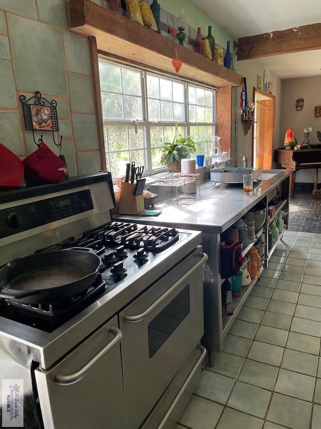 125 W Resaca Rd, Bayview, TX 78566 - kitchen featuring range with two ovens and light tile patterned flooring