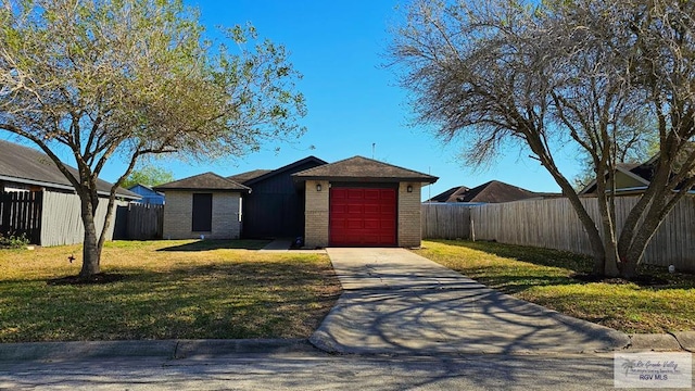 view of front facade featuring concrete driveway, fence, brick siding, and a front yard