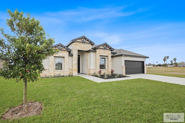 view of front of property with a garage, concrete driveway, a front lawn, and stone siding