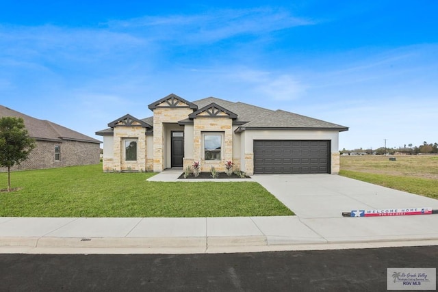 view of front of home featuring concrete driveway, stone siding, a front lawn, and an attached garage