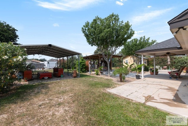 117 W 6th St, San Juan, TX 78589 - view of grassy yard featuring a gazebo, a carport, and a patio