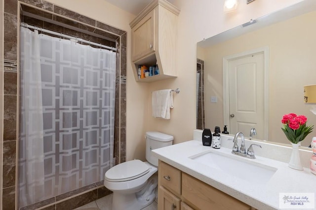 117 W 6th St, San Juan, TX 78589 - full bath with toilet, tiled shower, vanity, and tile patterned floors