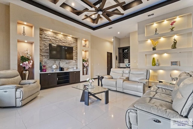 living room featuring light tile patterned floors, a ceiling fan, visible vents, coffered ceiling, and built in shelves