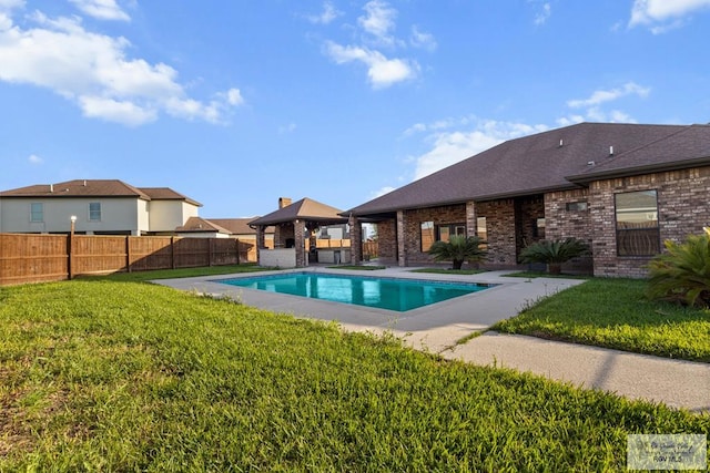 view of pool featuring a fenced in pool, a patio, a gazebo, a fenced backyard, and a yard