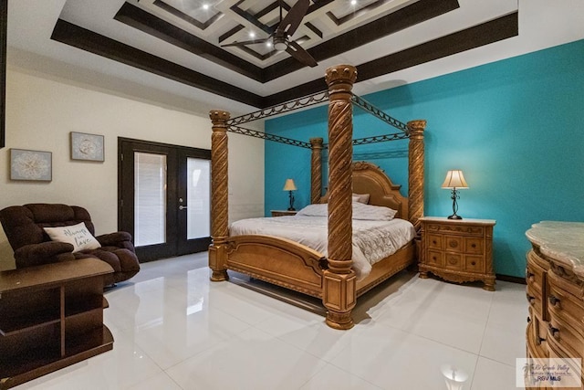 tiled bedroom featuring french doors, ceiling fan, a tray ceiling, and coffered ceiling