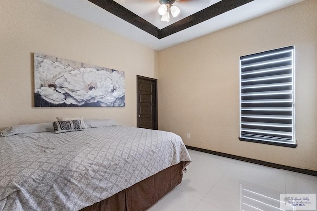 bedroom with tile patterned floors and a ceiling fan