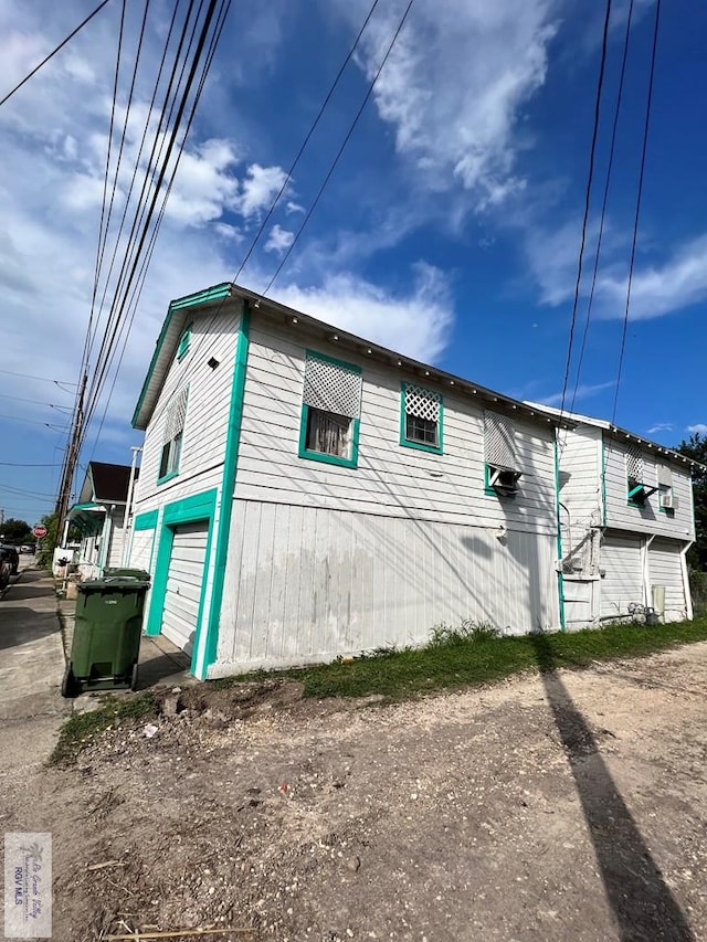 view of side of property with a garage