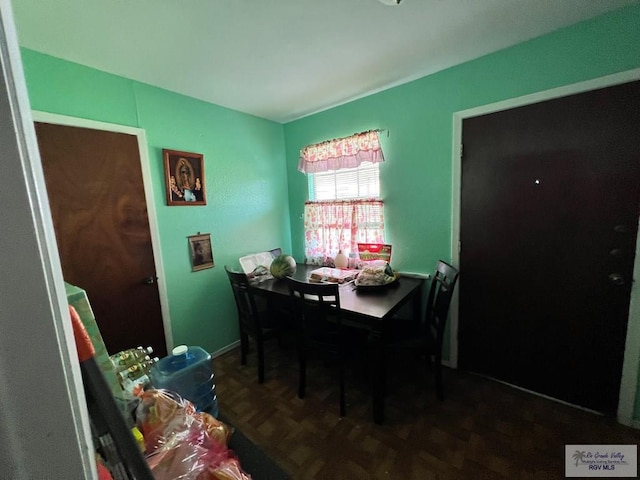 dining room with dark parquet floors