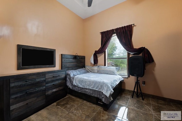 bedroom with ceiling fan and lofted ceiling