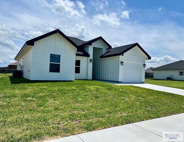 8713 Swan Lake Dr, Harlingen, TX 78552 - modern inspired farmhouse with board and batten siding, central AC unit, driveway, and a garage
