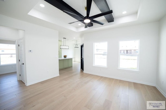 8713 Swan Lake Dr, Harlingen, TX 78552 - empty room featuring ceiling fan, light wood-type flooring, a raised ceiling, baseboards, and recessed lighting