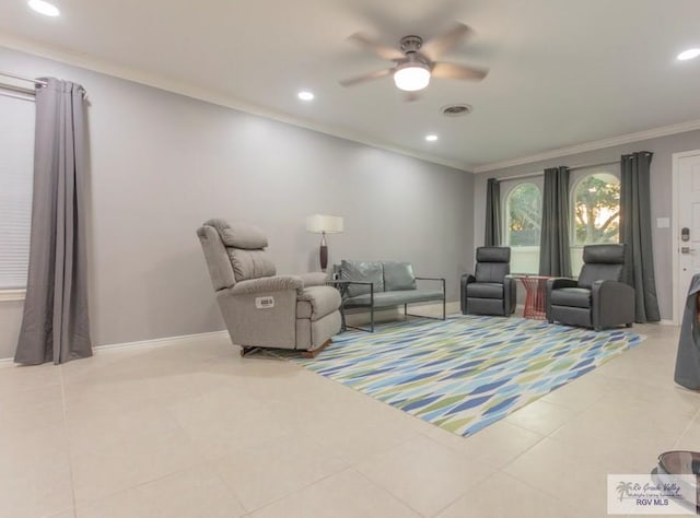 living room featuring ceiling fan, light tile patterned flooring, and crown molding