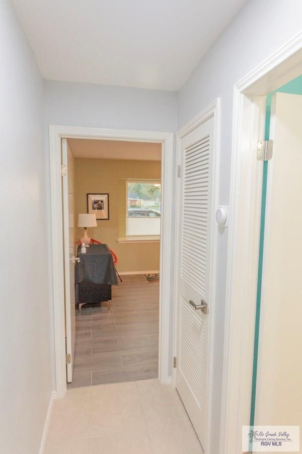 hall with light hardwood / wood-style floors