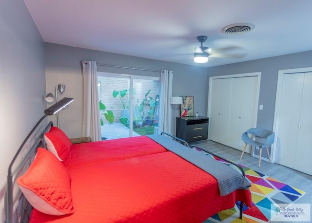 bedroom with access to exterior, ceiling fan, multiple closets, and light wood-type flooring