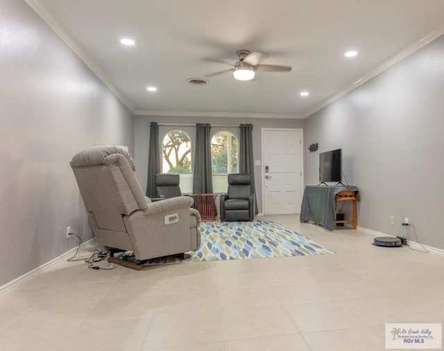 living area with ceiling fan, light tile patterned floors, and ornamental molding