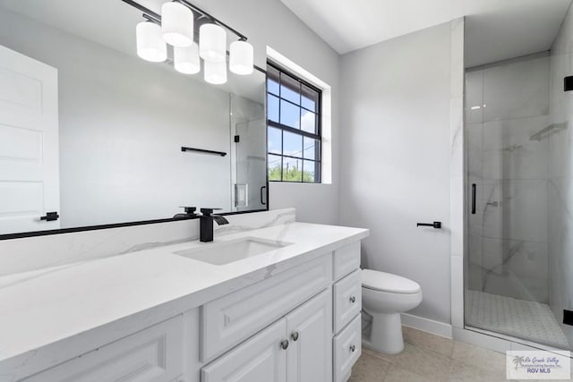 1214 W Monroe Ave, Harlingen, TX 78550 - full bath featuring toilet, vanity, a marble finish shower, baseboards, and tile patterned floors