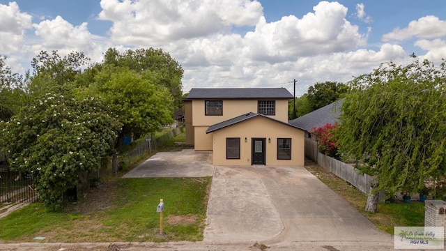 1214 W Monroe Ave, Harlingen, TX 78550 - traditional-style house with stucco siding and concrete driveway