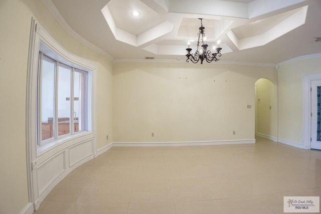 tiled spare room with crown molding, coffered ceiling, and a notable chandelier