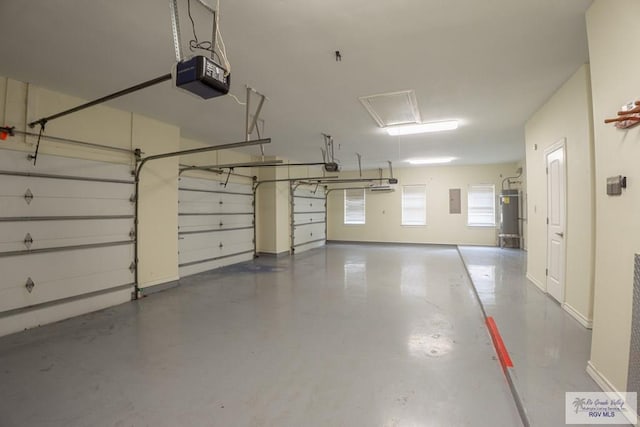 garage featuring electric panel and a garage door opener