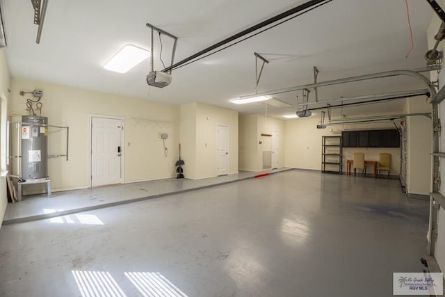 garage with a garage door opener and water heater