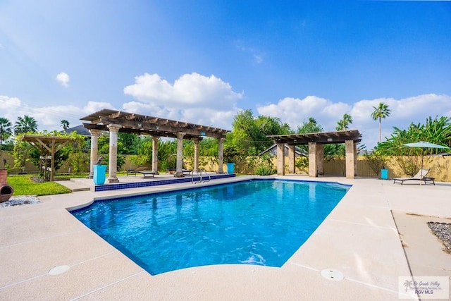 view of swimming pool featuring a pergola and a patio