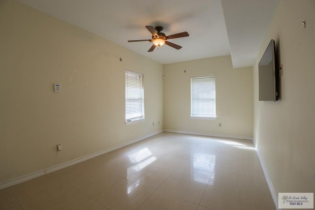 unfurnished room featuring ceiling fan and light tile patterned floors