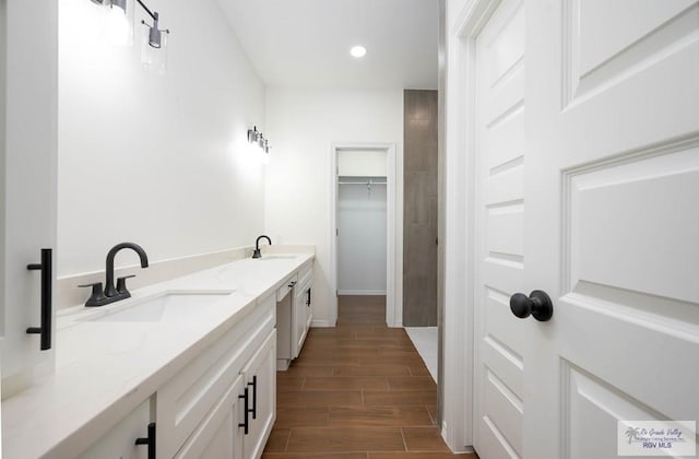 bathroom with wood-type flooring and vanity