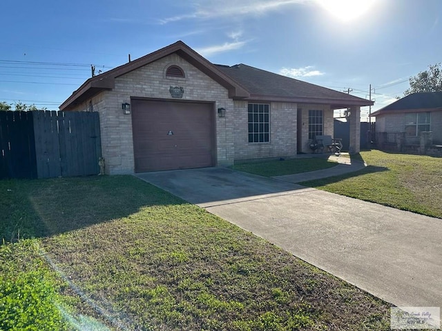 ranch-style house featuring a garage and a front yard