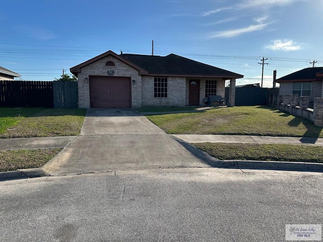 ranch-style home featuring a garage and a front yard