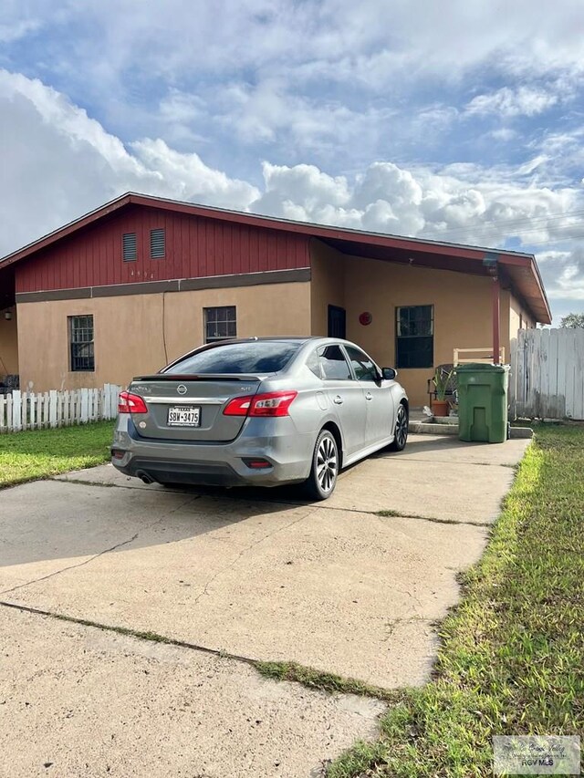 view of front of home featuring a carport