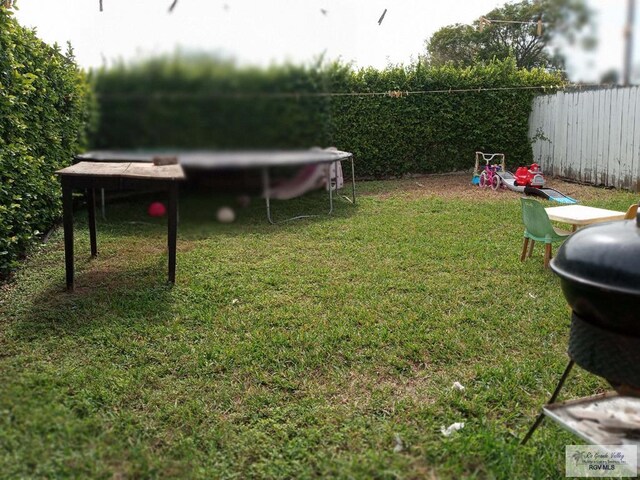 view of yard featuring a trampoline