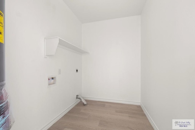 laundry room featuring hookup for a washing machine, laundry area, baseboards, light wood-style floors, and electric dryer hookup