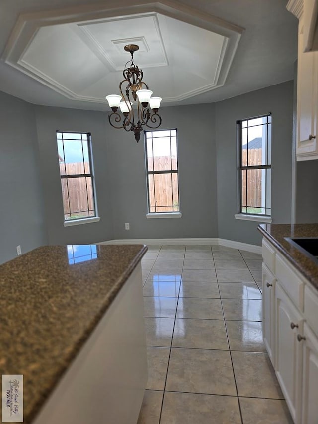 4116 Yoli Ln, Brownsville, TX 78521 - kitchen featuring healthy amount of natural light, white cabinets, and light tile patterned floors