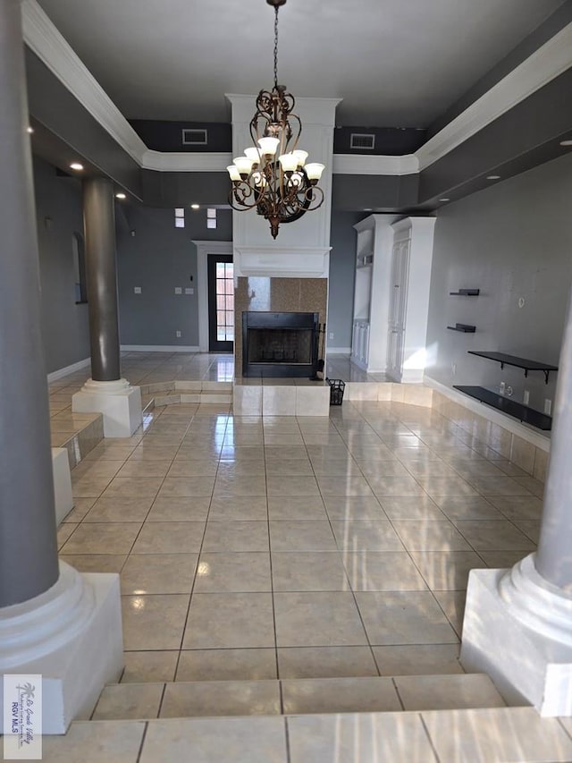 4116 Yoli Ln, Brownsville, TX 78521 - hallway featuring decorative columns, light tile patterned flooring, a chandelier, and ornamental molding