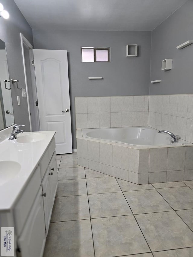 4116 Yoli Ln, Brownsville, TX 78521 - full bathroom with a garden tub, double vanity, and tile patterned floors