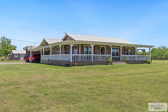 30202 Ratliff Rd, San Benito, TX 78586 - farmhouse inspired home featuring covered porch, a carport, a front yard, driveway, and metal roof