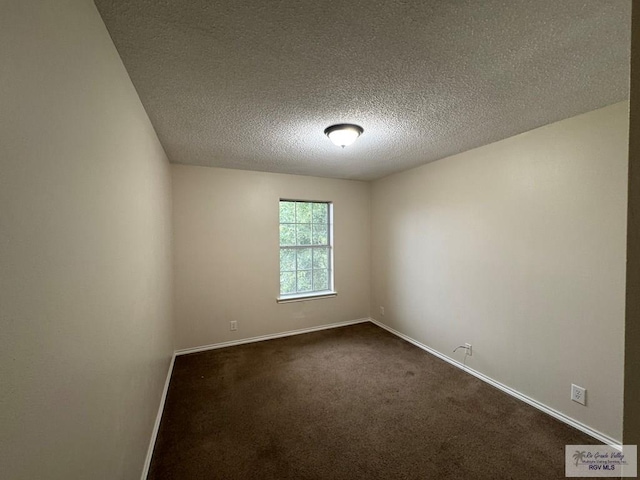 1072 Vamonos Dr, Brownsville, TX 78526 - spare room featuring dark carpet and a textured ceiling